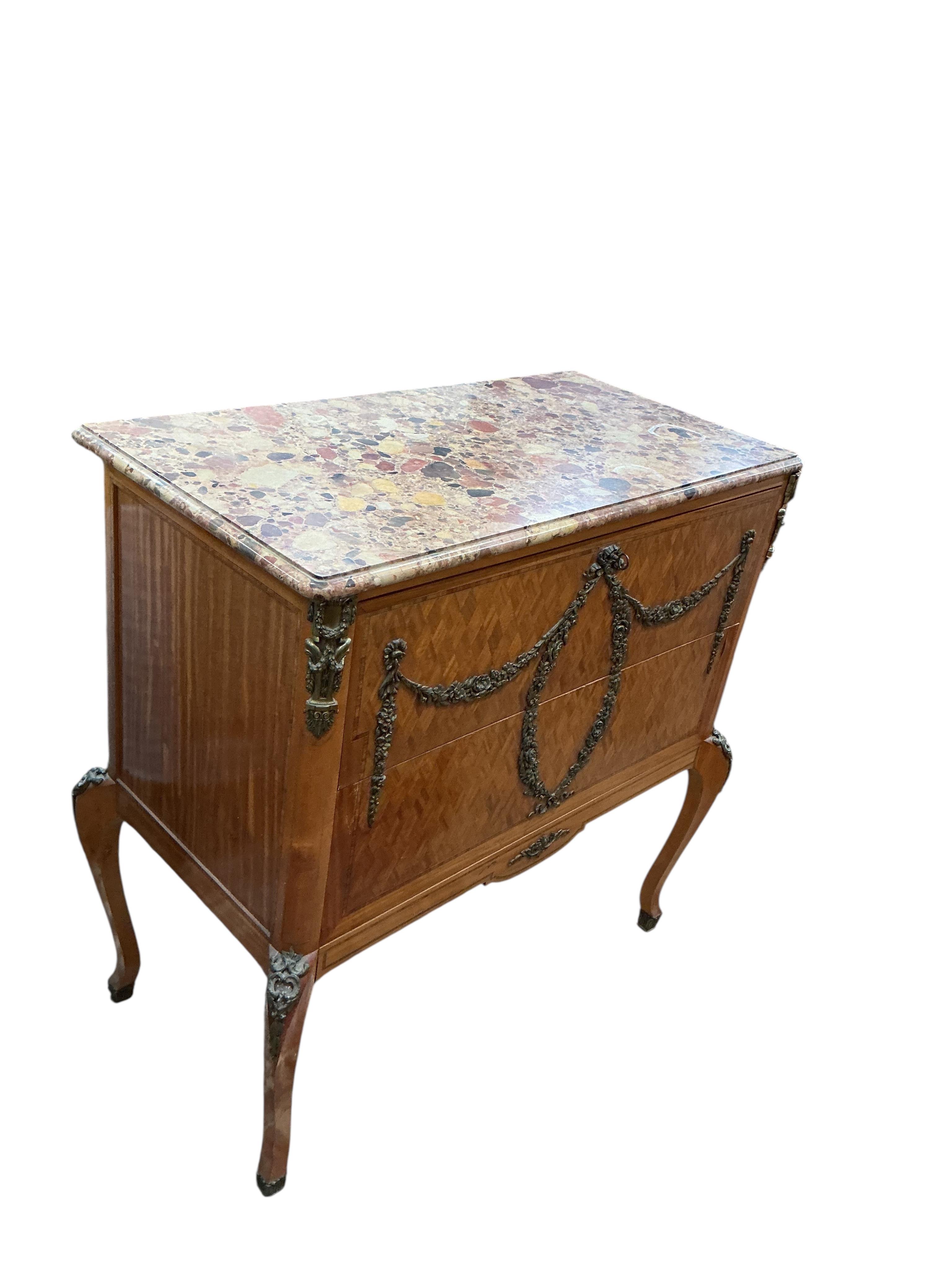 An early 20th century French transitional style gilt metal mounted parquetry inlaid marble top secretaire chest, width 99cm, depth 50cm, height 101cm